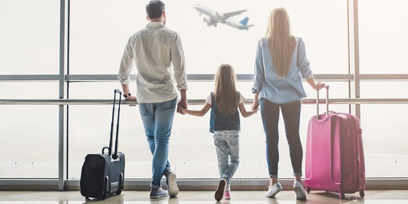 Family of four preparing to travel